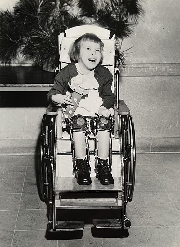 old photo of girl in wheelchair